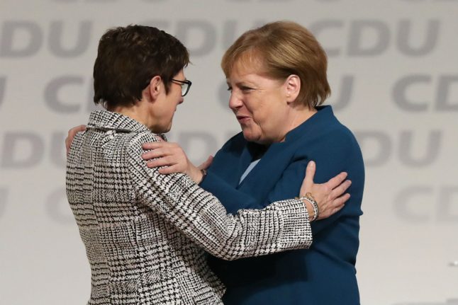 Merkel loyalist wins CDU party vote to succeed her