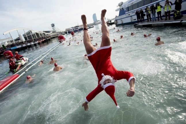 IN PICS: Santa-clad swimmers brace cold for annual Christmas swim in Barcelona