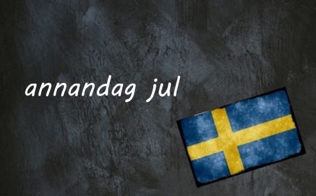 the word annandag jul on a black background by a swedish flag