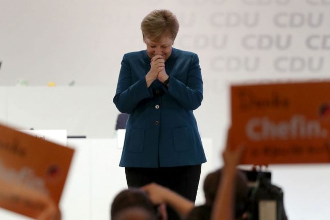 Merkel stresses 'Christian, democratic values' as she quits party leadership