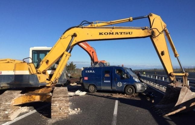 Armed gang use diggers to ‘rip open’ security van