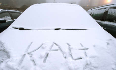 Kalt is written on a car covered in snow.