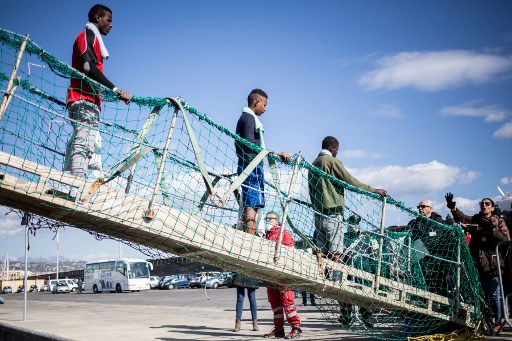 Migrants land in Sicily as ship's crew faces uncertain fate