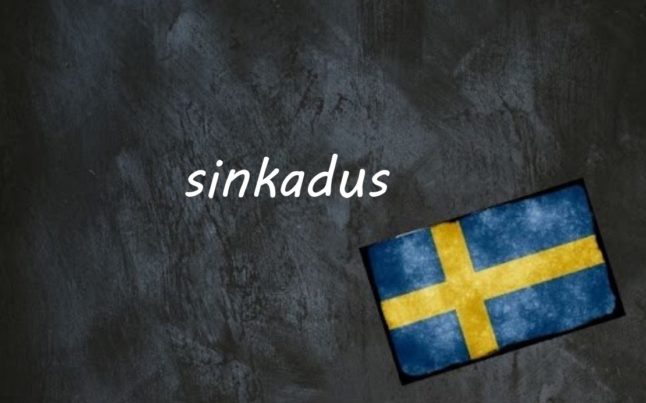 the word sinkadus written on a blackboard next to the swedish flag
