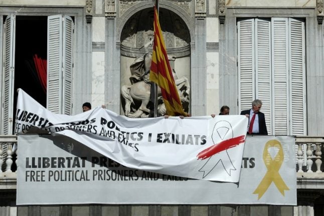 Spain files lawsuit against Catalan president over pro-independence symbols