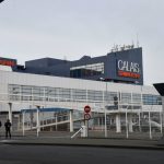 Migrants scramble aboard Calais ferry, sparking police sweep
