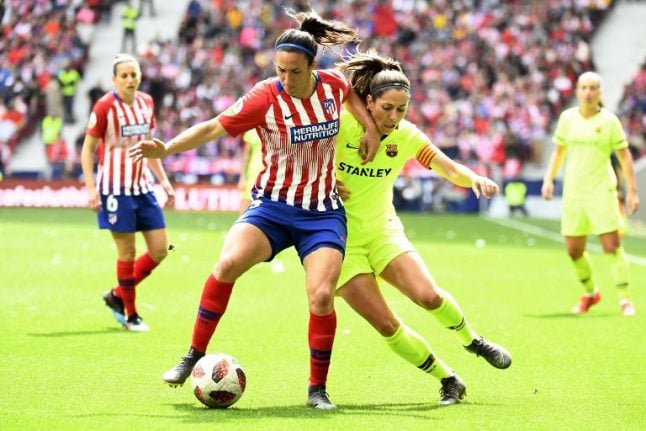 Women's football match draws record crowd in Madrid