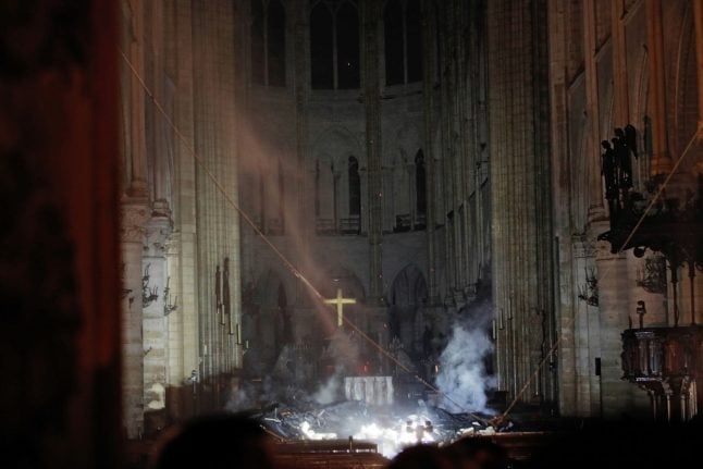 French billionaire pledges €100m to rebuild Notre-Dame as flames finally brought under control