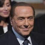 Italy's Berlusconi leaves hospital after op and vows to fight election