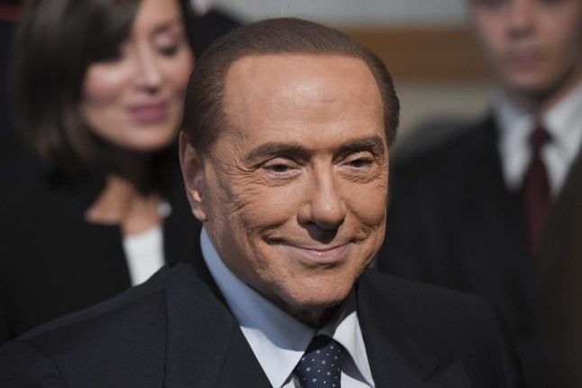 Italy's Berlusconi leaves hospital after op and vows to fight election