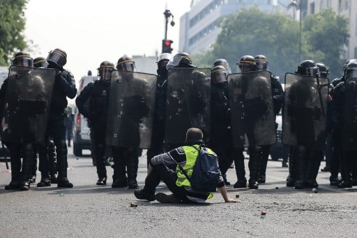 Investigation after Paris police officer apparently hurled paving stone at protesters
