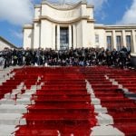 Green activists spill fake blood on Paris’s Trocadero