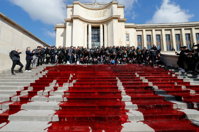 Green activists spill fake blood on Paris's Trocadero