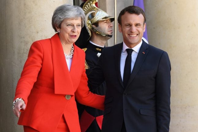 France demands 'rapid clarification' over Brexit as British PM May announces resignation