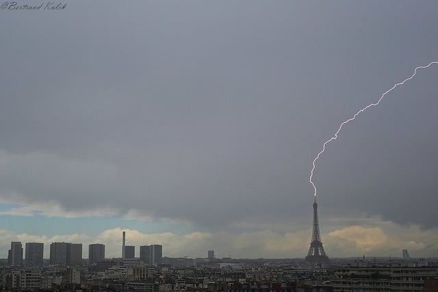 In pictures: Eiffel Tower struck by lightning as storms hit Paris