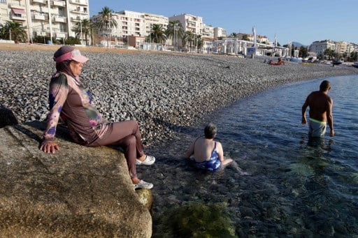 Swimming pools in French town close in row over burkini ban