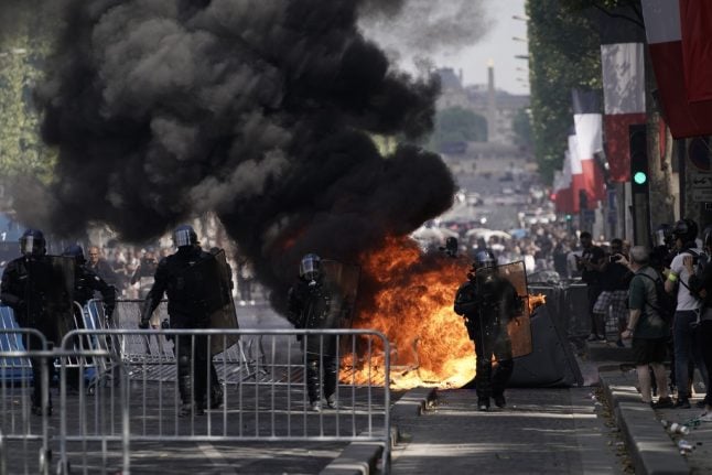 French police battle 'yellow vest' protesters then Algeria football fans in tense Bastille Day