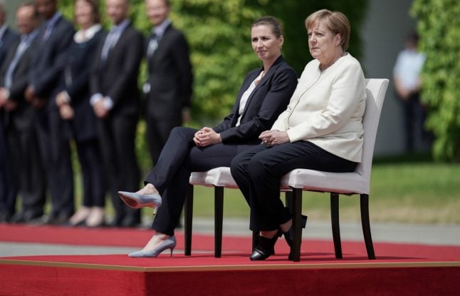 ‘I take care of my health’: Merkel sits through official ceremony after trembling spells