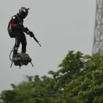 French inventor soars on flyboard above Bastille Day parade