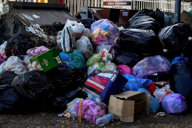Rome residents tape bins shut in protest over rubbish crisis