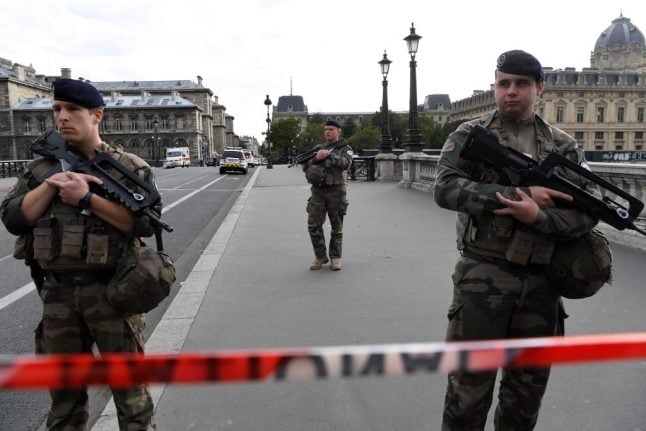 Paris police HQ killer 'stabbed three colleagues before beating a fourth to death'