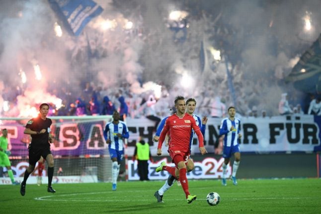Fireworks and ‘ultra’ pitch invasions as Union win first top-flight Berlin derby