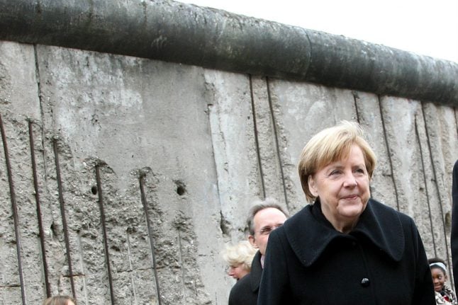 Sauna and oysters: Merkel remembers Berlin Wall fall