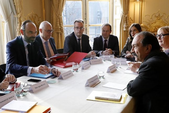 French PM meets defiant unions in bid to break pension strike deadlock