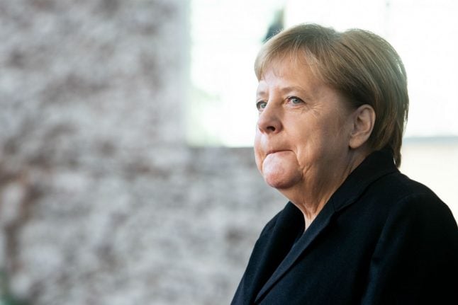 Merkel given reprieve as coalition partner votes not to split