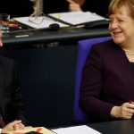 Bumps ahead for Merkel after ally loses shock vote