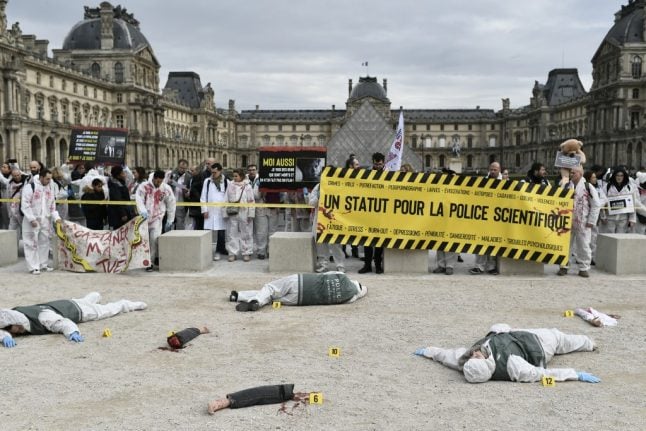 IN PICTURES: French police forensic staff stage 'severed limbs' protest