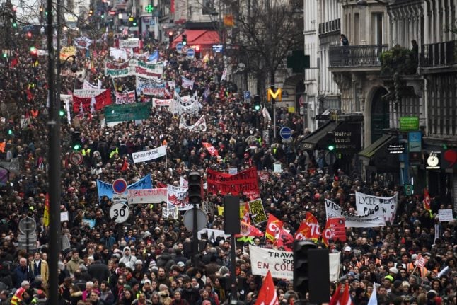 LATEST: Tens of thousands protest across France as strikes cause more transport disruption