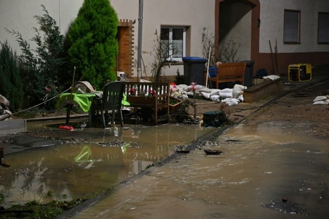 Roads, railways and homes flooded as heavy rain hits Germany
