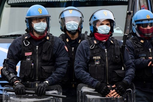 Police hunt escaped prisoners in southern Italy after quarantine sparks riots