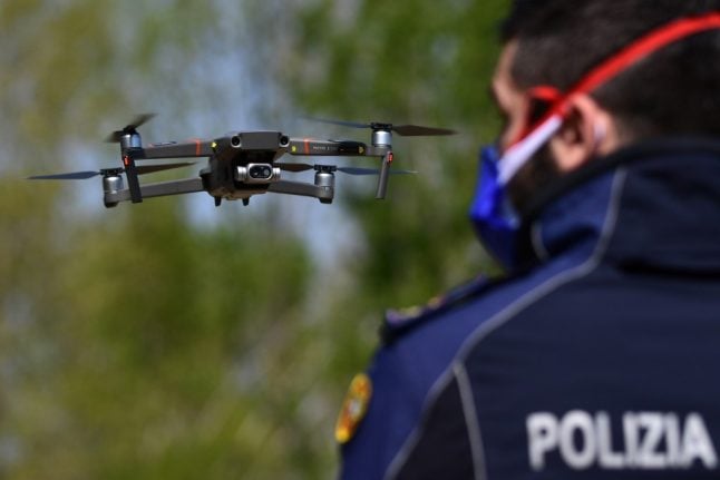 Hovering police drones take Italians' temperature and issue fines