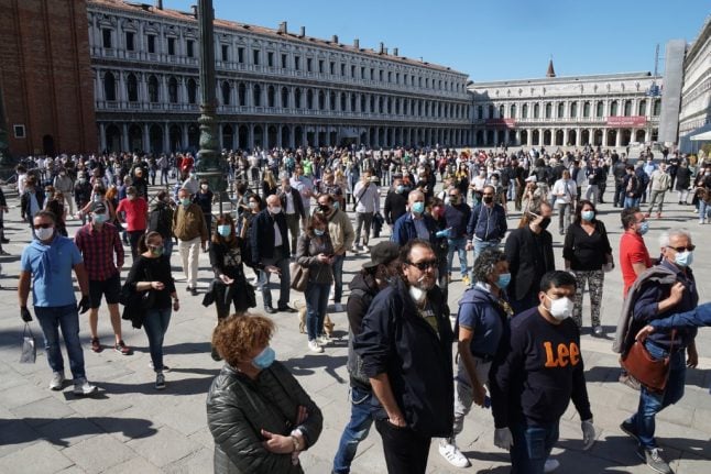 Italy considers reopening shops earlier following protests