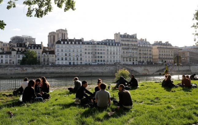 Paris police ban alcohol on canal and riverbanks after crowds gather on first day after lockdown