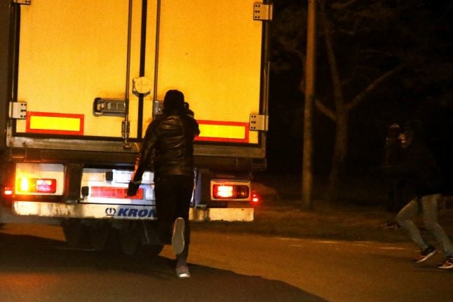 Paris police arrest 13 in migrant smuggling case linked to lorry deaths in UK