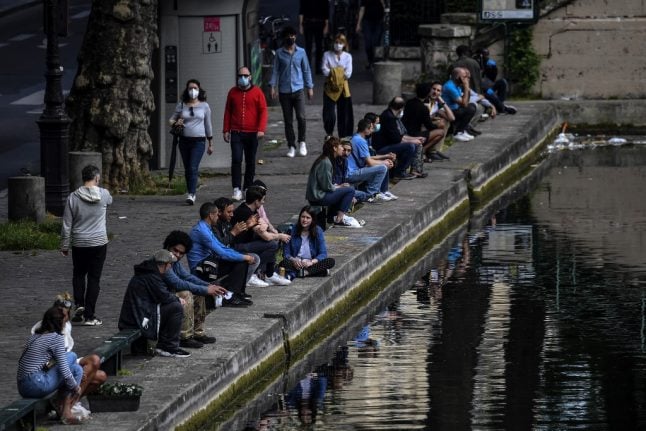 Paris police disperse crowds from trendy Canal Saint-Martin after scores gather