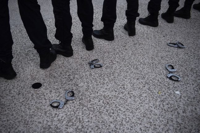 Why have police in France thrown down their handcuffs?