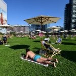 ‘It’s not the seaside, but nearly’: Milan residents test out new urban ‘beach’
