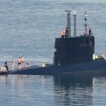 Norwegian submarine crew strips down to trunks and bikinis