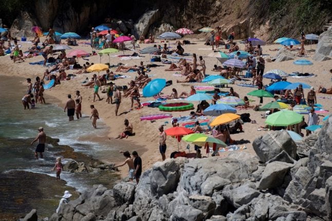 Dozens of Spanish beaches close over virus fears as crowds of sunbathers gather