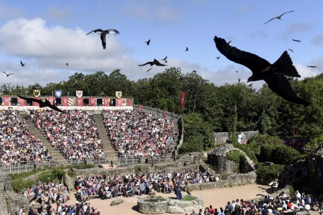 French government defends allowing theme park's 9,000-person show