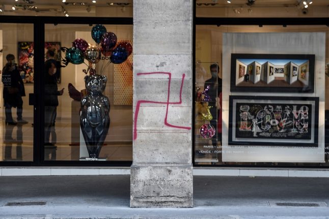 Paris police arrest man over swastika graffiti near Louvre