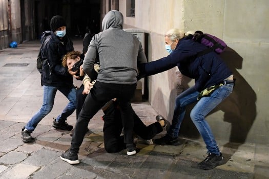Looting and vandalism during second night of protests in Spain over Covid restrictions