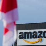 Amazon workers across Germany go on strike for higher wages in build up to ‘online Xmas’