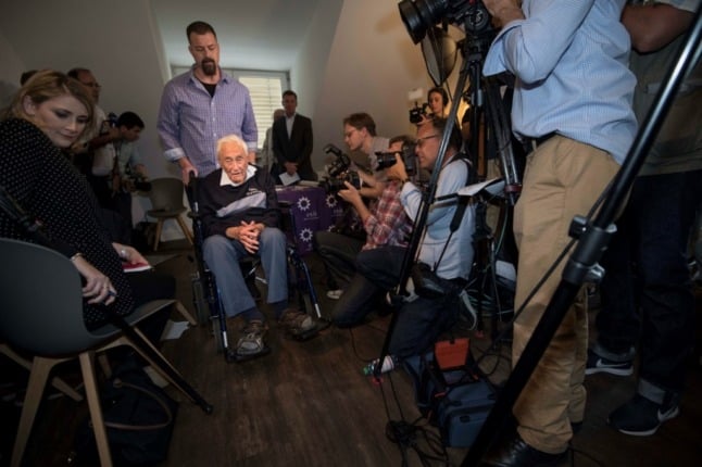 Australian scientist David Goodall (C) leaves in a wheelchair. He was barred from seeking help to end his life in Australia, so he was forced to travel to Switzerland. (Photo by SEBASTIEN BOZON / AFP)