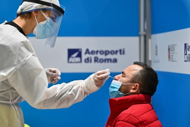 A passenger arriving in Rome gets tested for coronavirus.