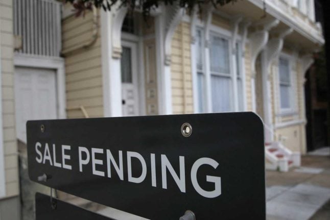 A sign outside a house which says 'sale pending'. Can foreigners buy a home - or any kind of property-  in Switzerland? Photo: AFP